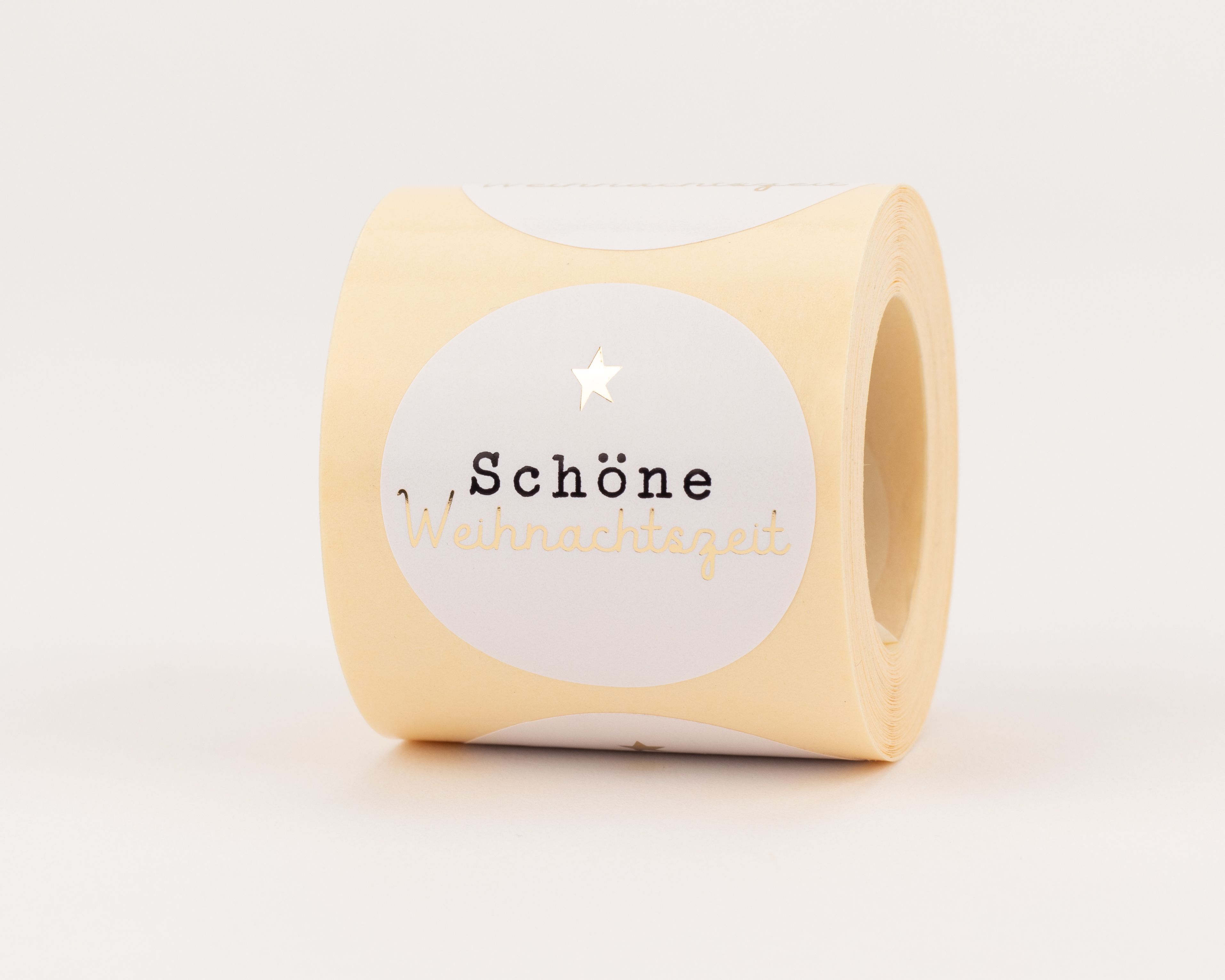 Aufkleber mit rundem, weißem Design, das den gold-schwarzen Schriftzug 'Schöne Weihnachtszeit' und einen Goldstern zeigt