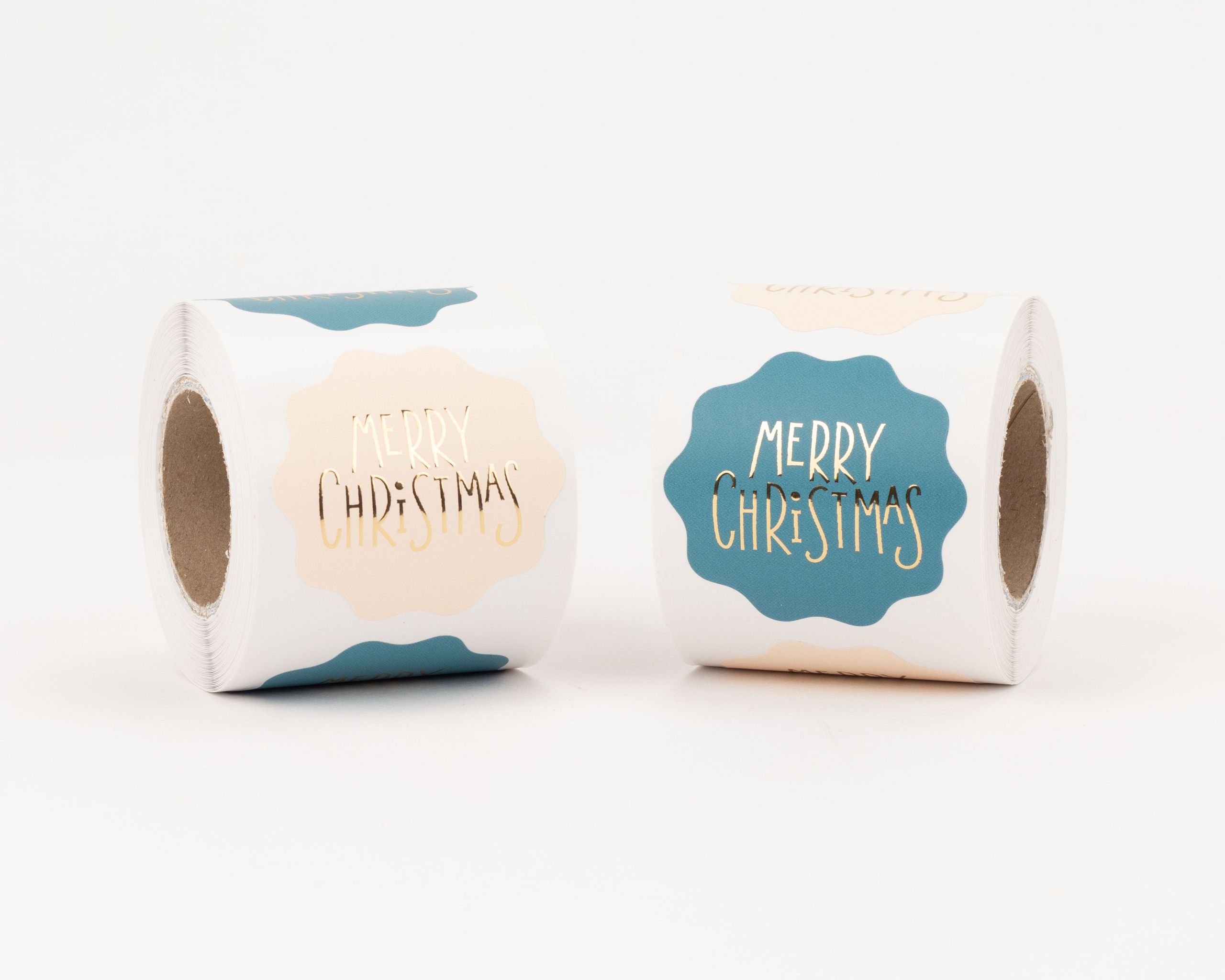Aufkleber mit zwei verschiedenen Designs, darunter beige und petrolfarbene Varianten, jeweils mit goldener 'Merry Christmas' Aufschrift