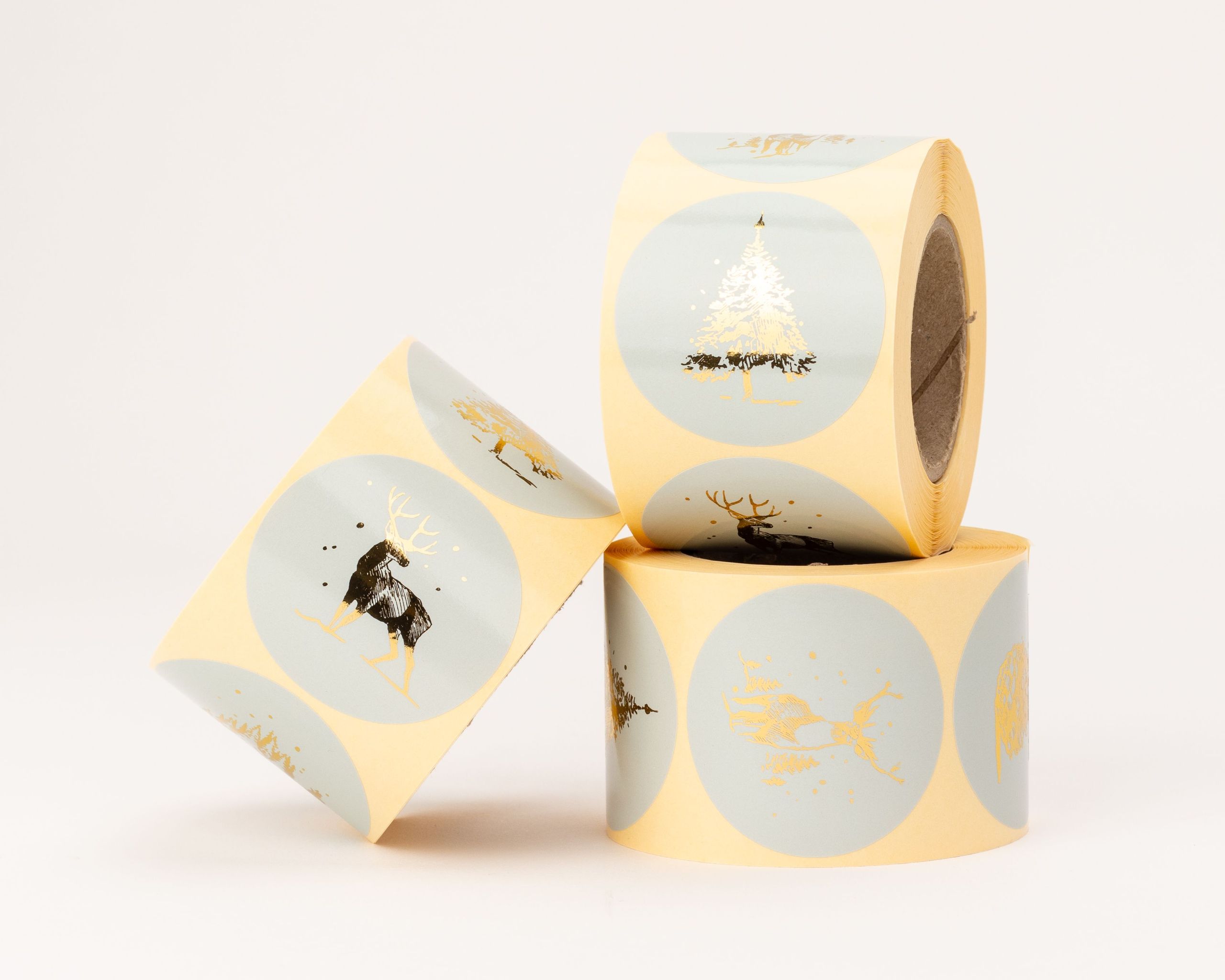 Aufkleber mit verschiedenen skandinavischen Weihnachtsmotiven in Blau und glänzendem Gold-Effekt, darunter Hirsche und Tannenbäume