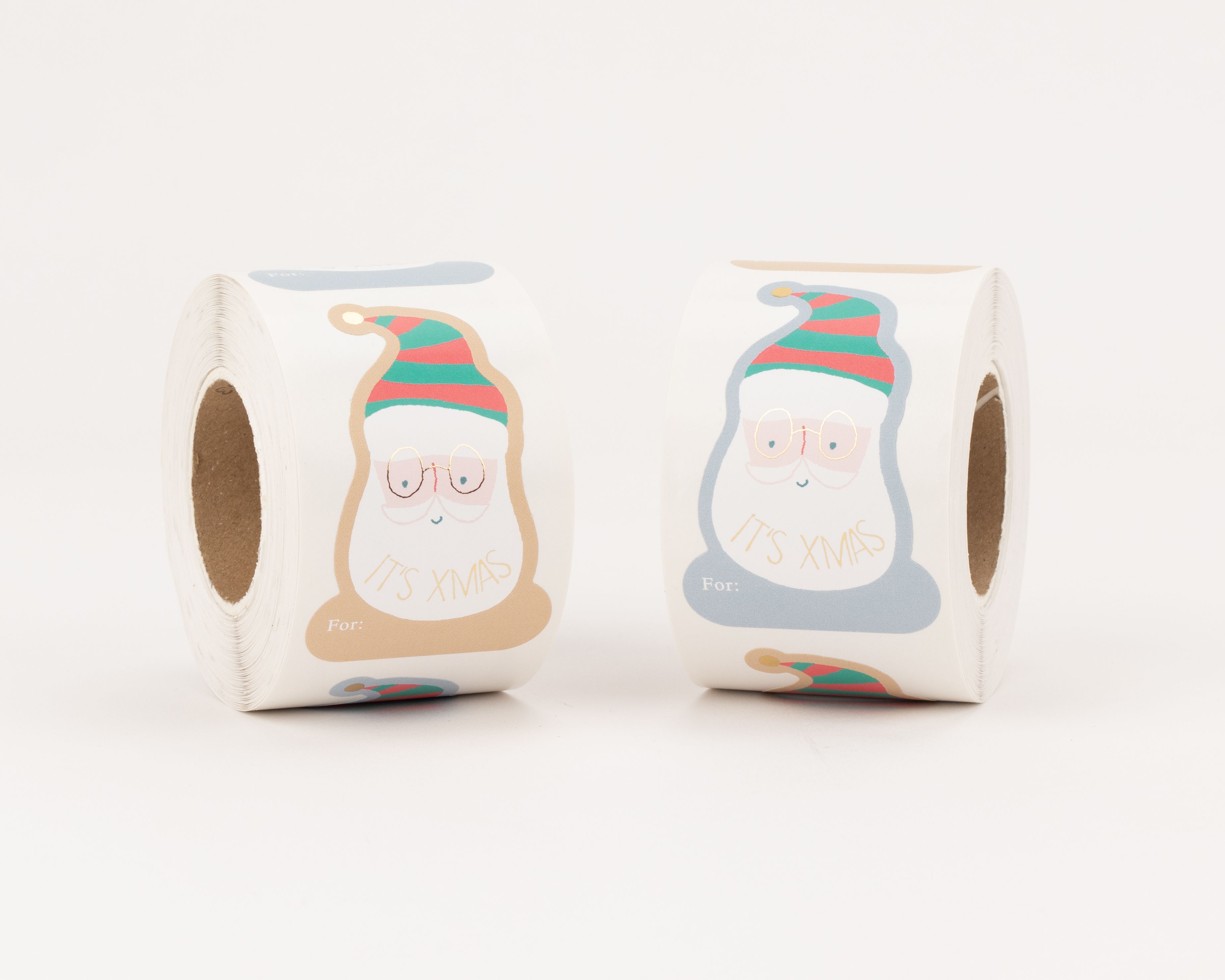 Aufkleber mit zwei Santa Claus Motiven in Beige, Blau, Grün, Rot, Gold-Effekt und 'IT'S XMAS' Schriftzug