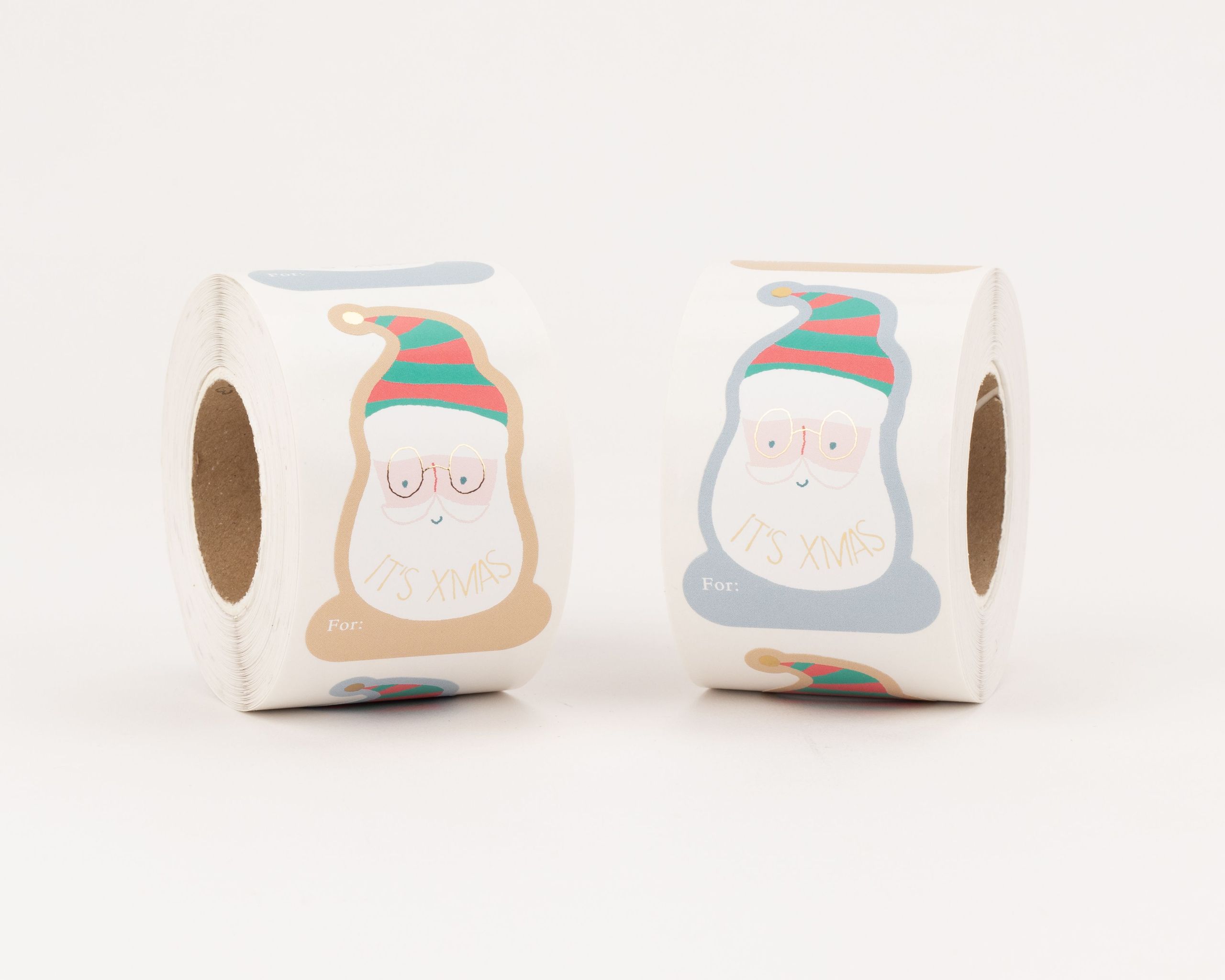 Aufkleber mit zwei Santa Claus Motiven in Beige, Blau, Grün, Rot, Gold-Effekt und 'IT'S XMAS' Schriftzug