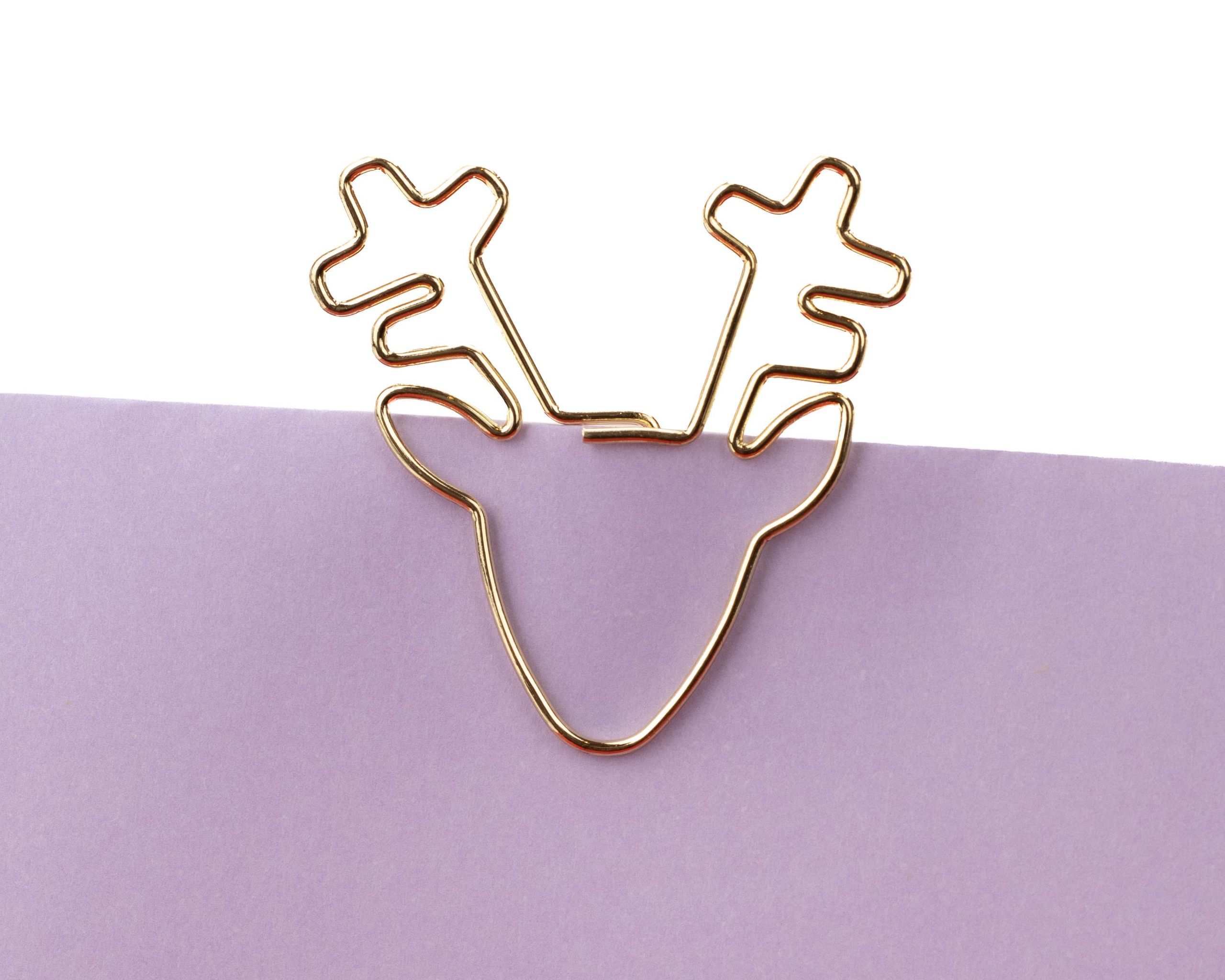 Goldfarbene Design-Clips aus glänzendem Metall in der besonderen Form eines Rentierkopfes