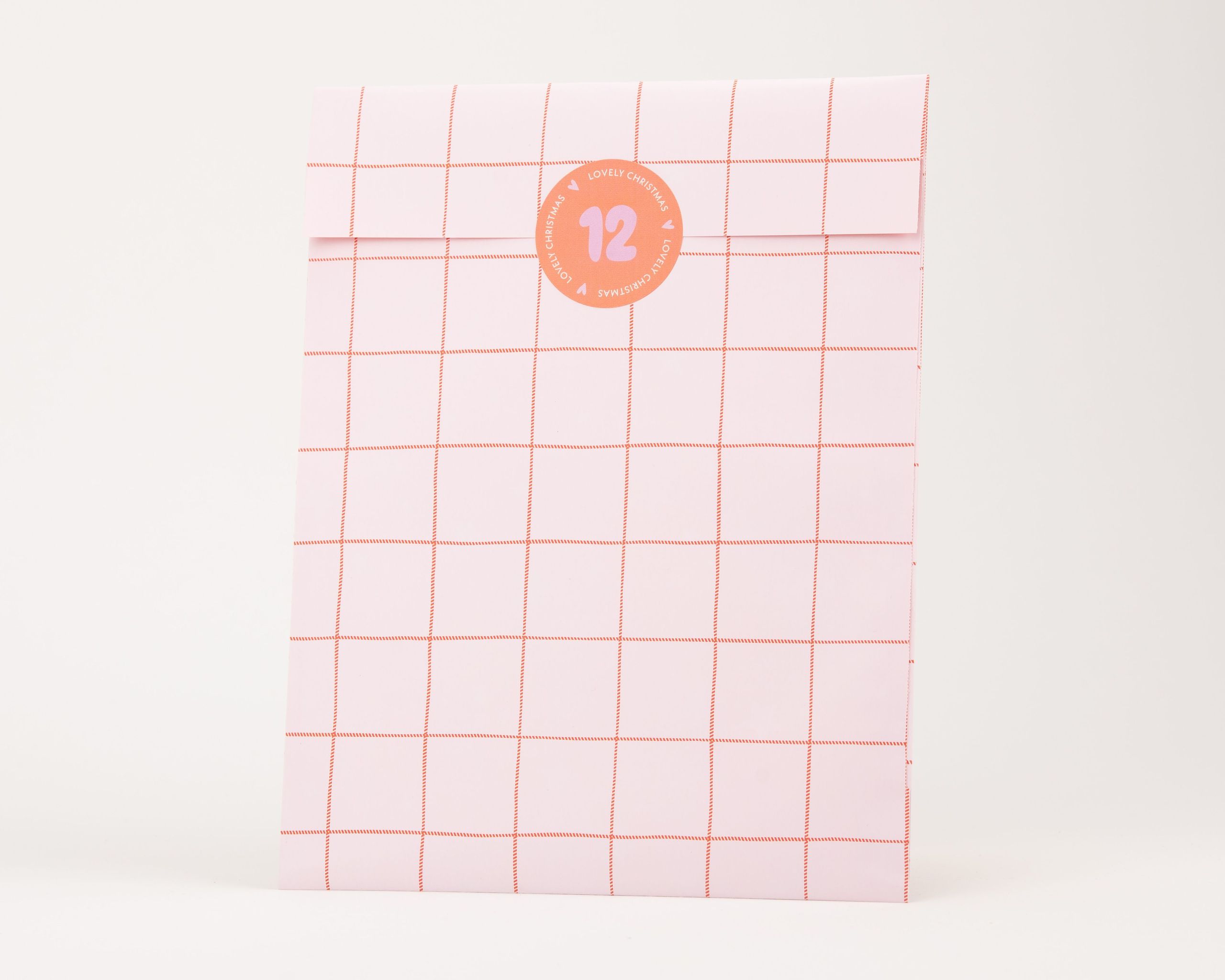 Papiertüten Flachbeutel in Hellrosa mit einem Karomuster in Orangerot die Innenseite ist hellrosa