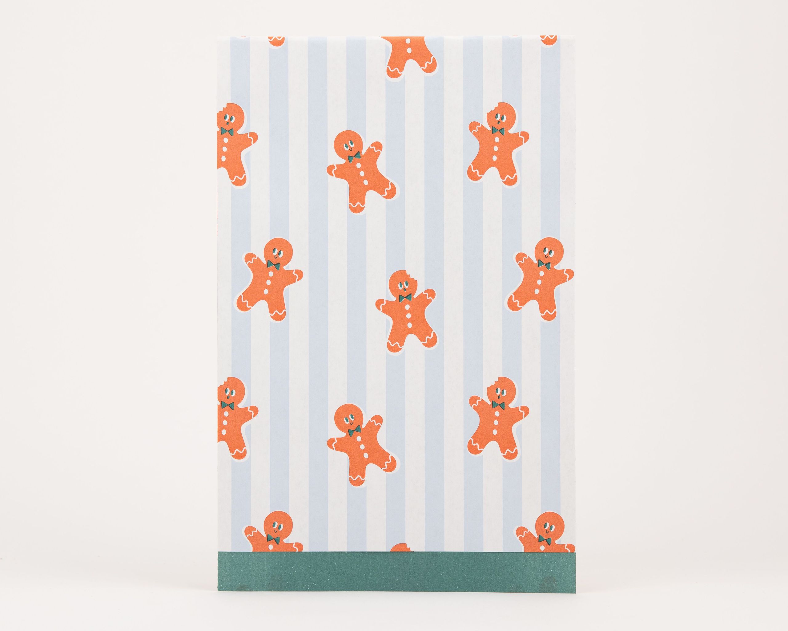 Papiertüten Flachbeutel mit blau-weiß gestreiftem Muster und orangefarbenen Lebkuchenmännchen, die Innenseite ist grün