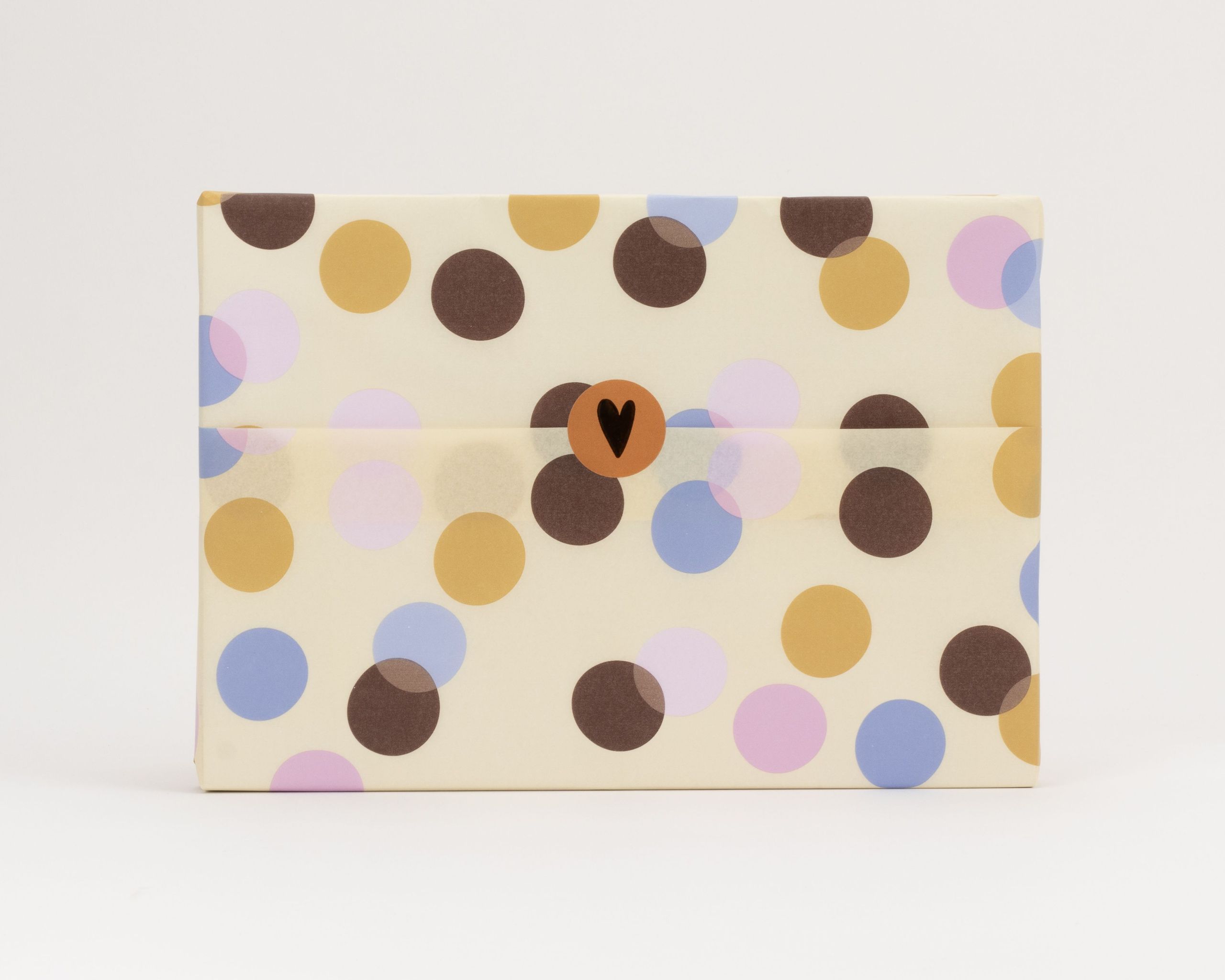 Seidenpapier mit Konfetti-Muster auf cremefarbenem Grund in Flieder, Hellblau, Warmem Orange und Hellrosa