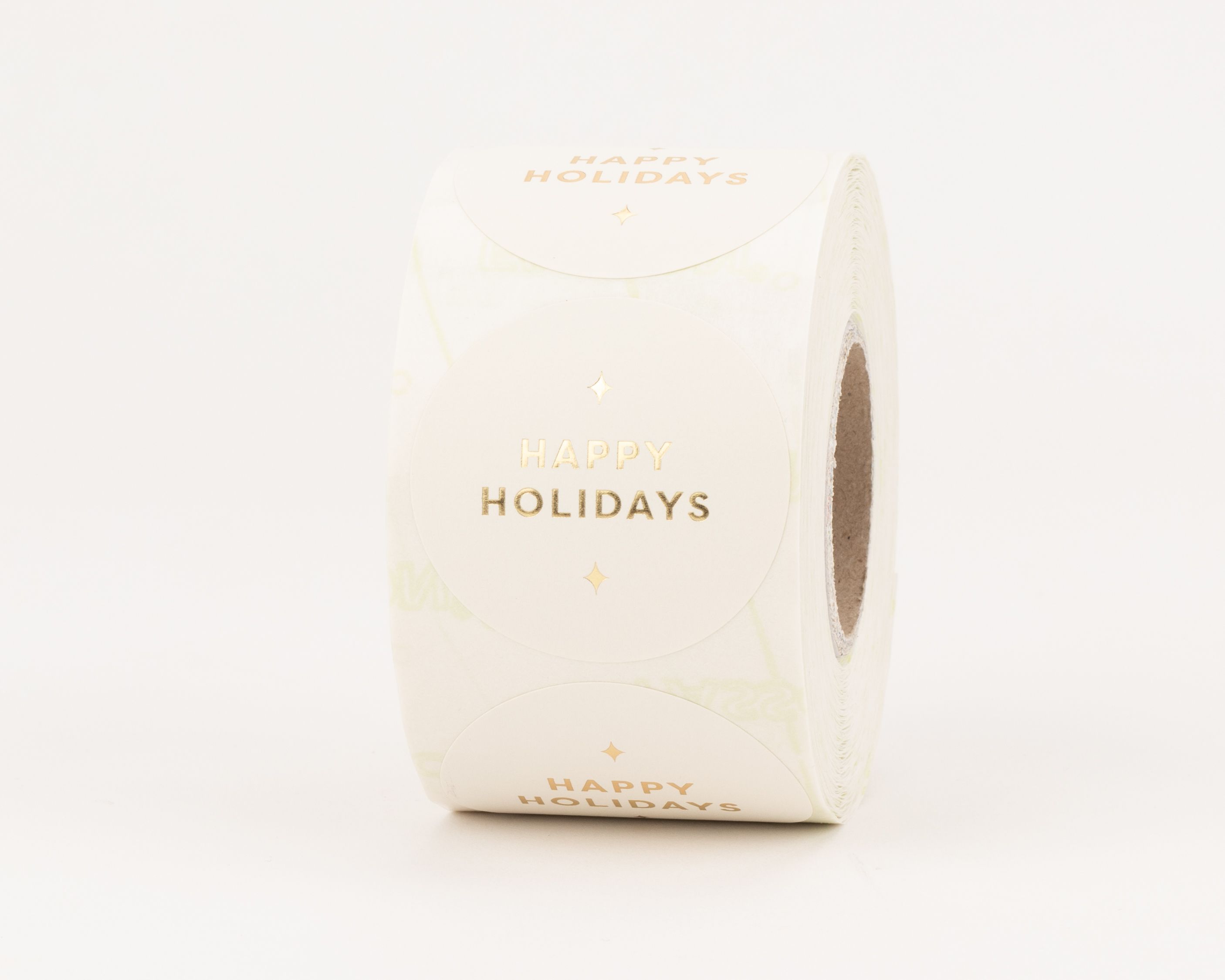 Sticker mit dem goldenen Schriftzug 'Happy Holidays' und einem Gold-Effekt auf einem matten, weißen Hintergrund