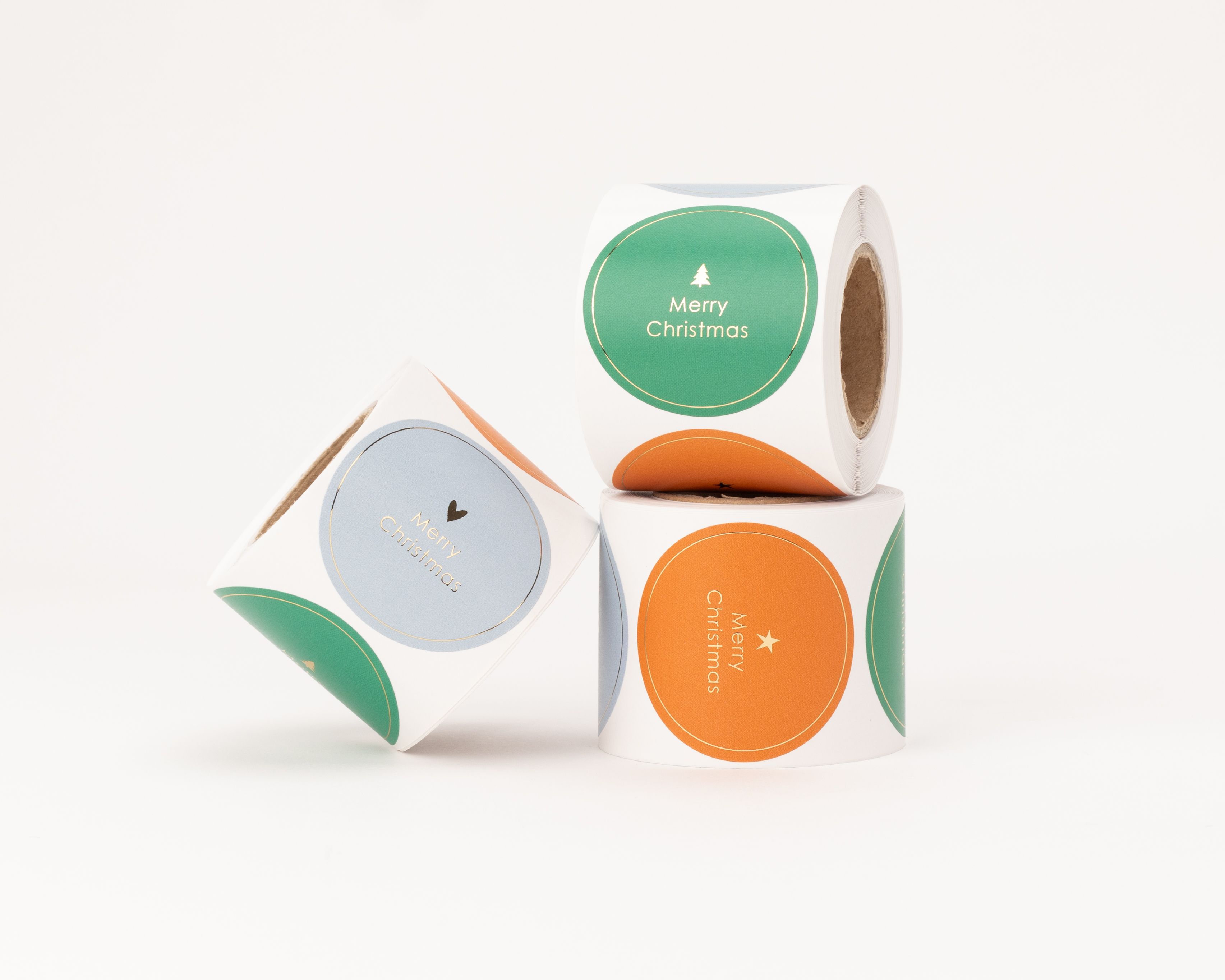 Aufkleber mit verschiedenen Merry Christmas Motiven in Blau, Grün und Orange, verziert mit Herz, Stern und Tanne sowie einem Gold-Effekt