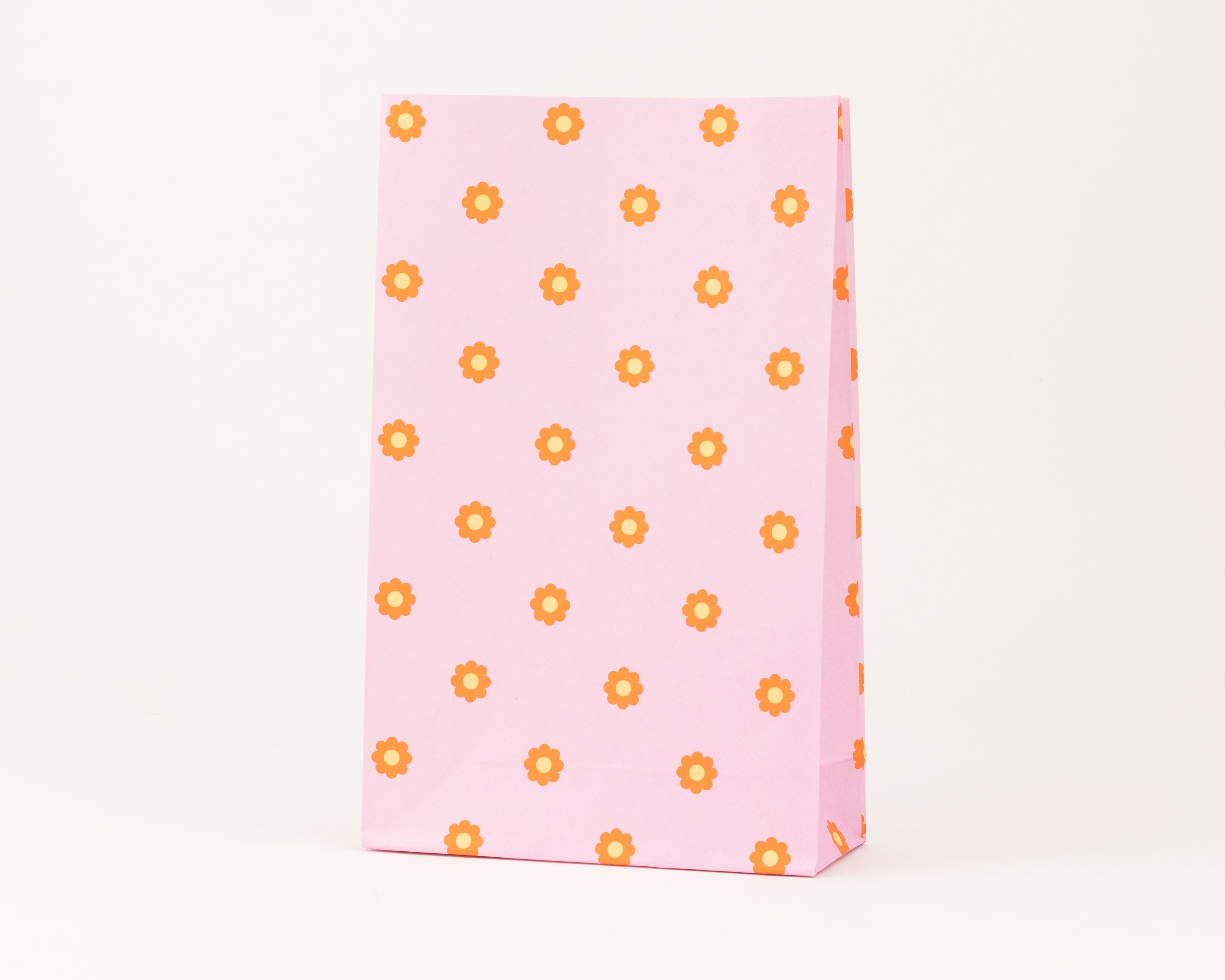 Papiertüten Blockbodenbeutel in Pink mit orange-gelbem Blumenmuster