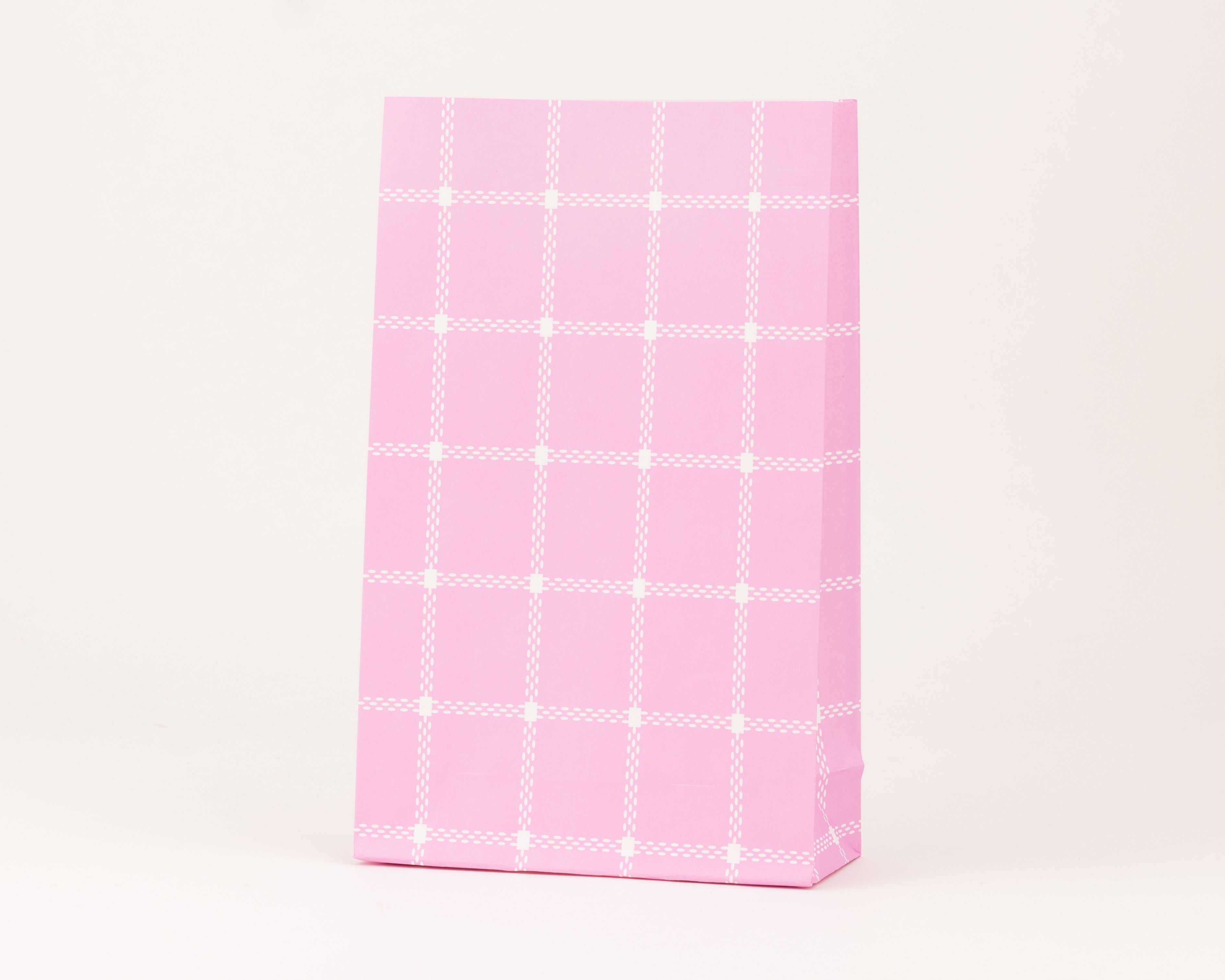 Papiertüten Blockbodenbeutel in Pink, verziert mit einem weißen Karomuster aus gepunkteten Linien