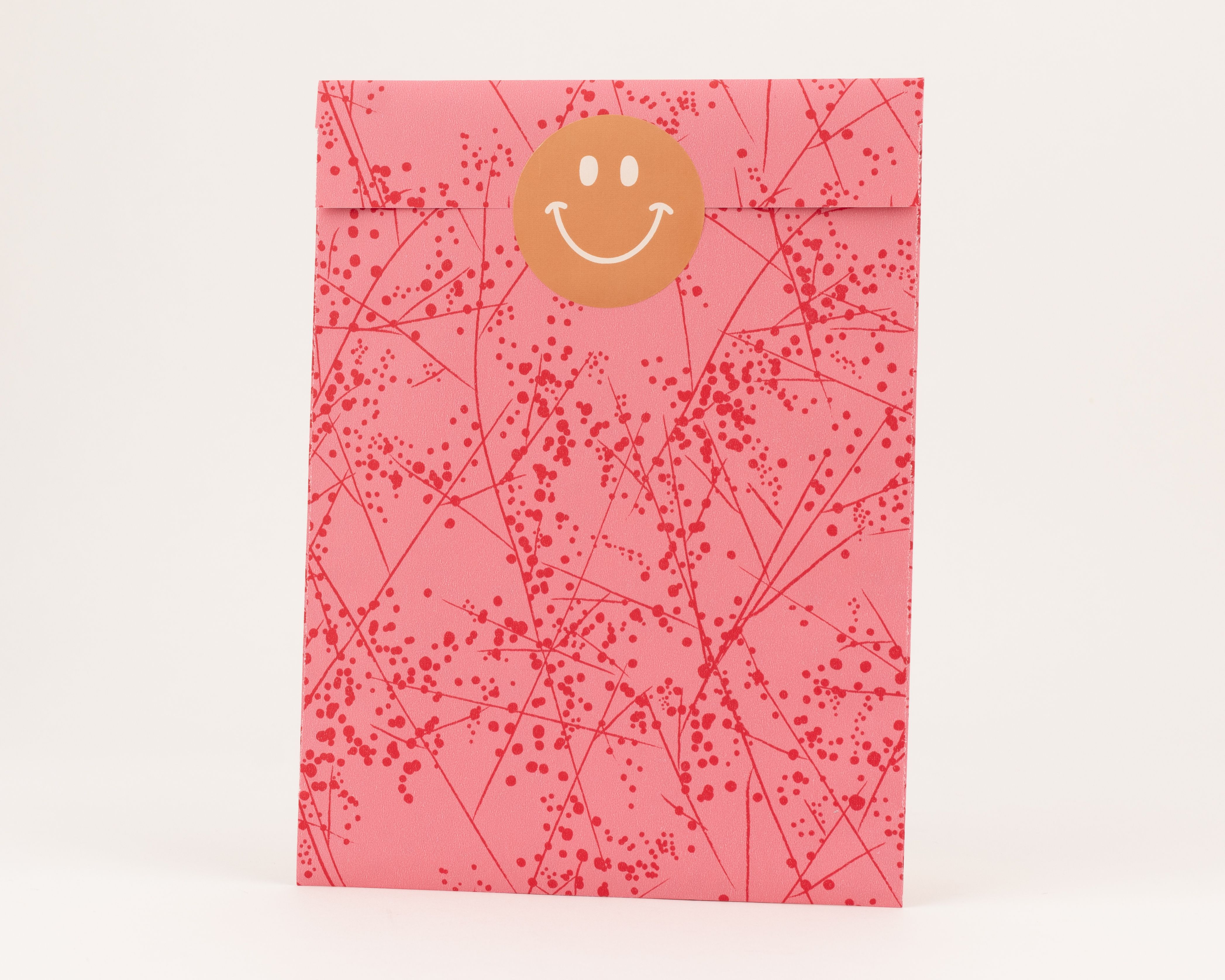 Flachbeutel in Pink mit einem feinen roten Zweig- und Punktemuster. Die Innenseite ist ebenfalls Pink und hat das gleiche Muster