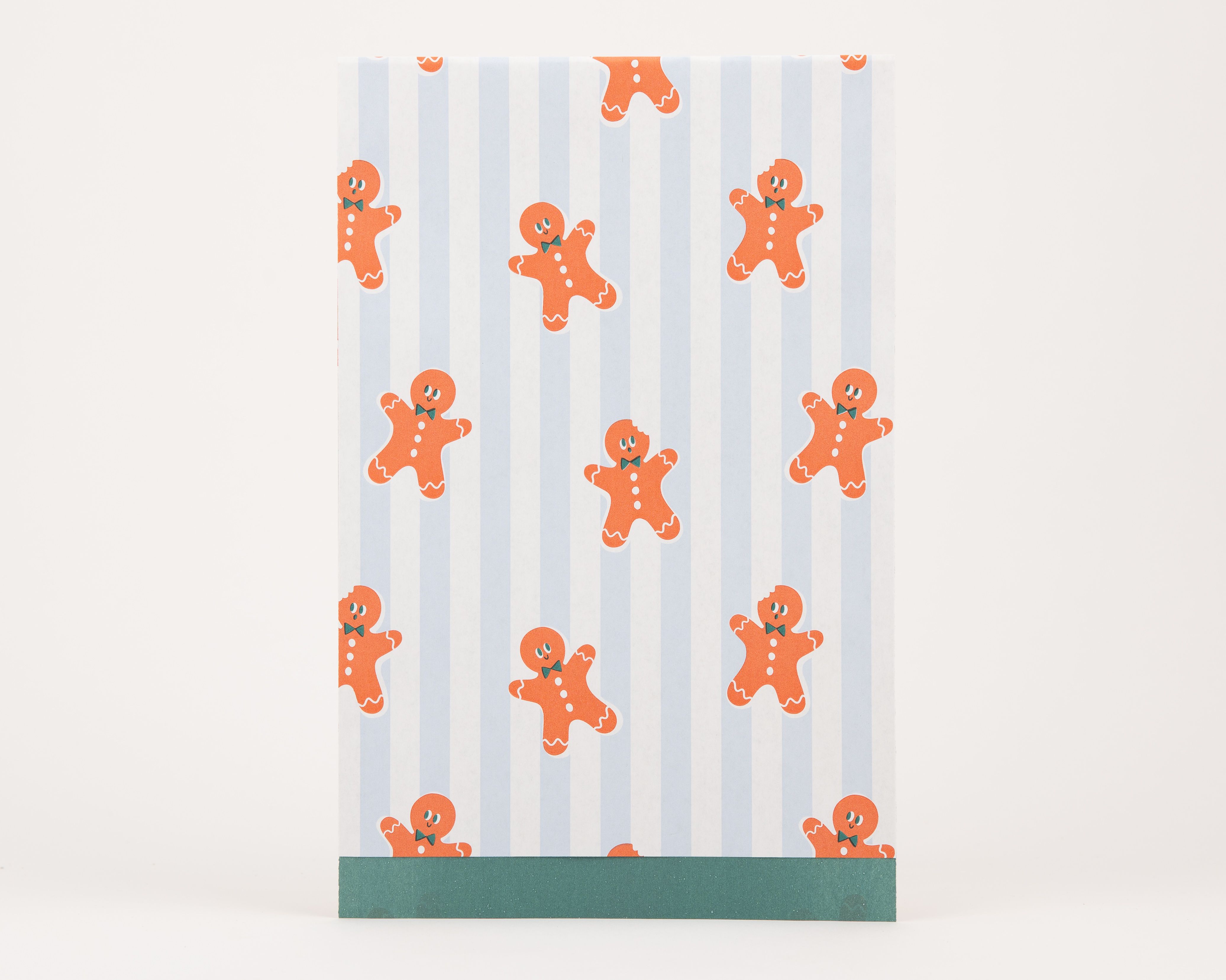 Papiertüten Flachbeutel mit blau-weiß gestreiftem Muster und orangefarbenen Lebkuchenmännchen, die Innenseite ist grün