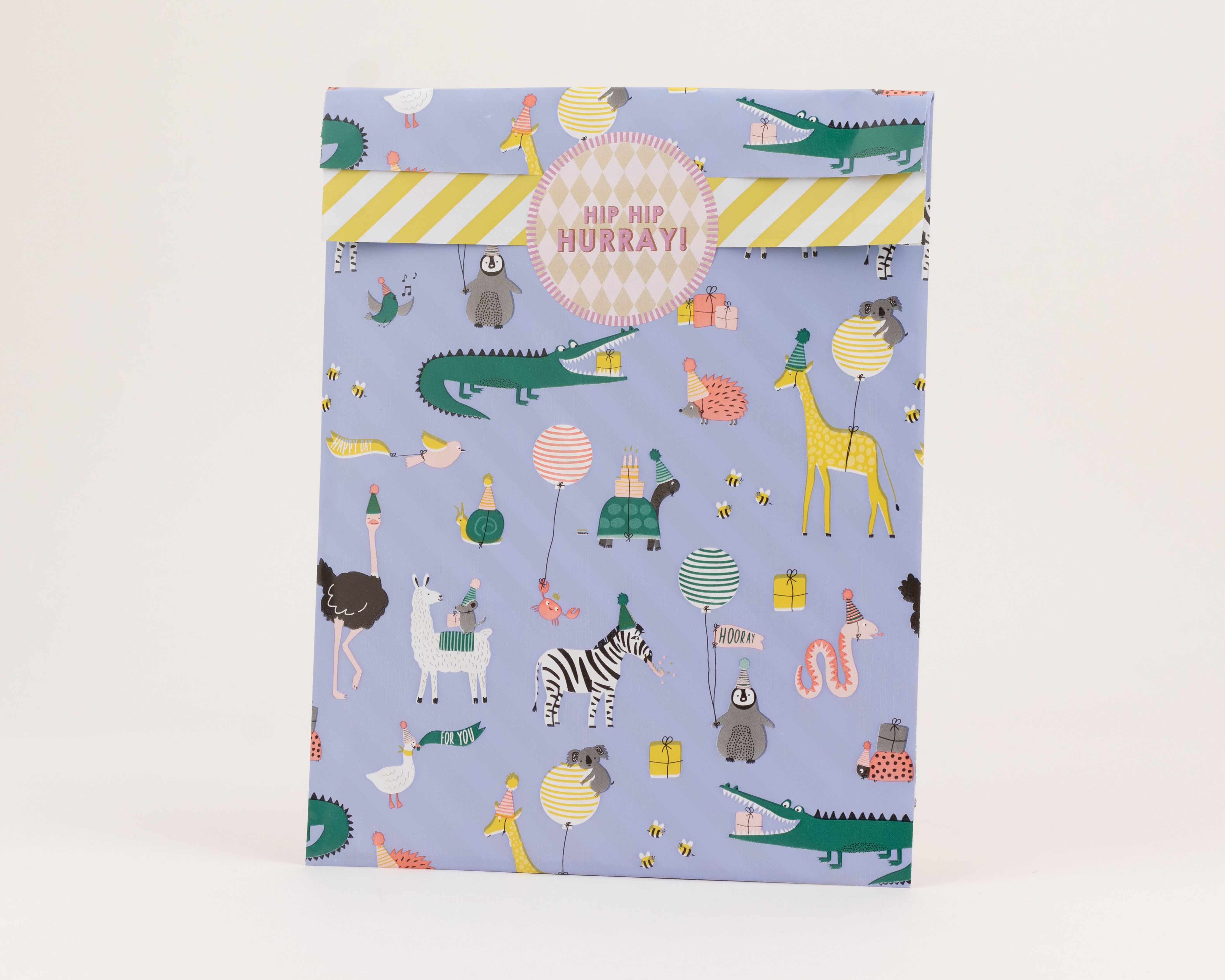 Flachbeutel mit blauem Hintergrund, verziert mit einem bunten Party-Tiermotiv in Gelb und Grün, Innenseite mit gelb-weißen Streifen