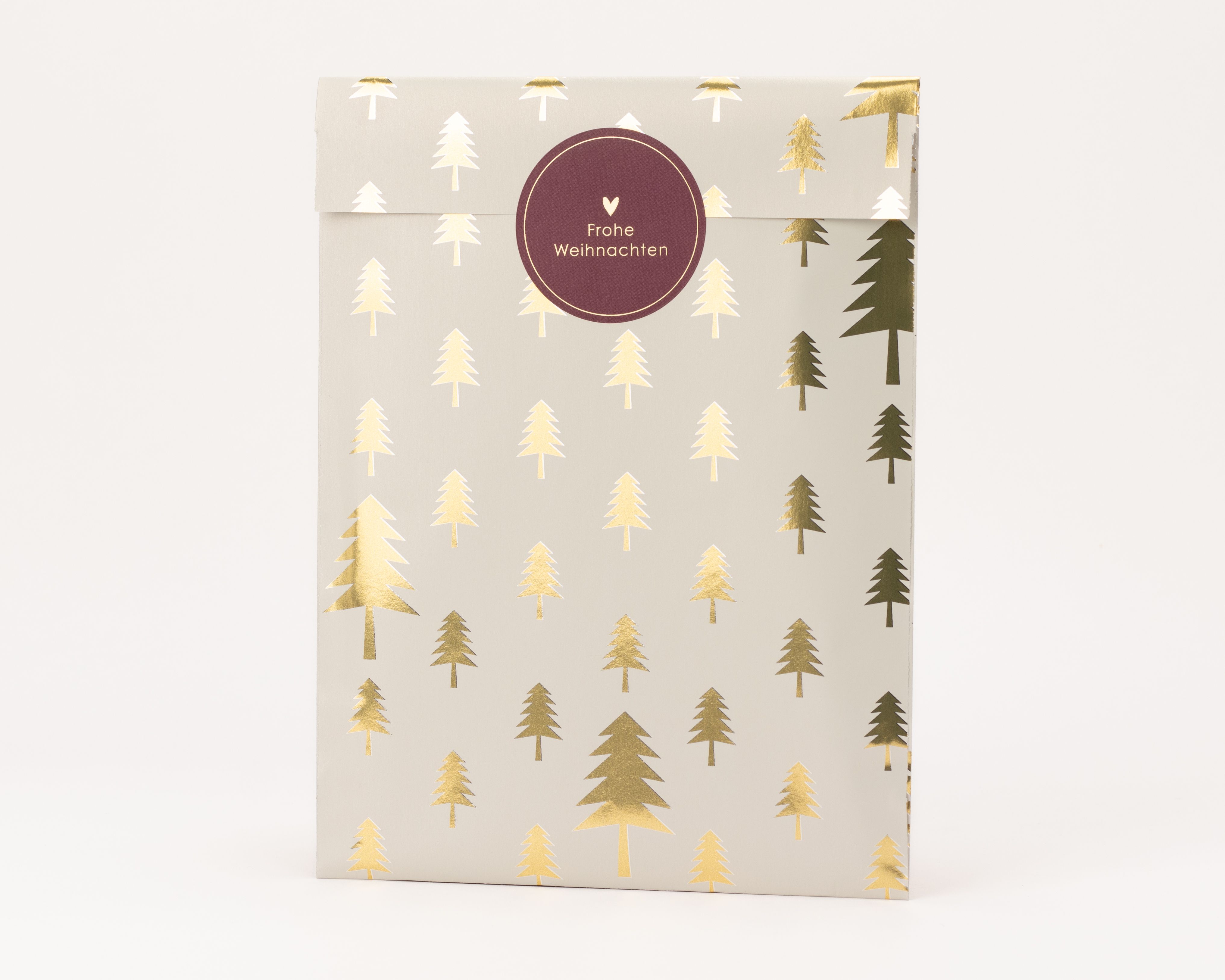 Flachbeutel mit beigem Hintergrund und glänzenden goldenen Tannenbaum-Mustern, die Innenseite ist weiß