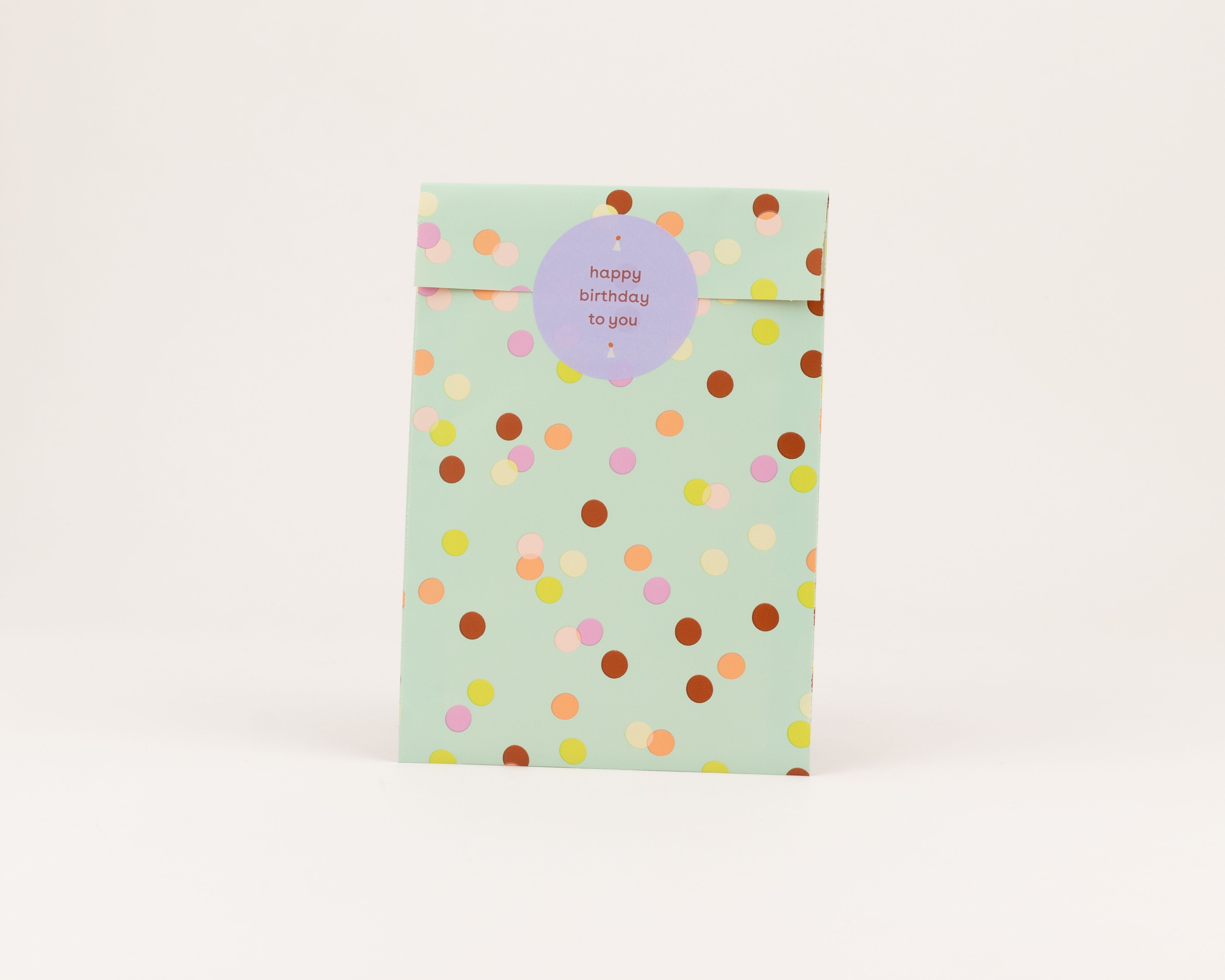 Flachbeutel in Minzgrün mit farbigem Konfettimuster aus gelben, orangen, pinken und braunen Punkten