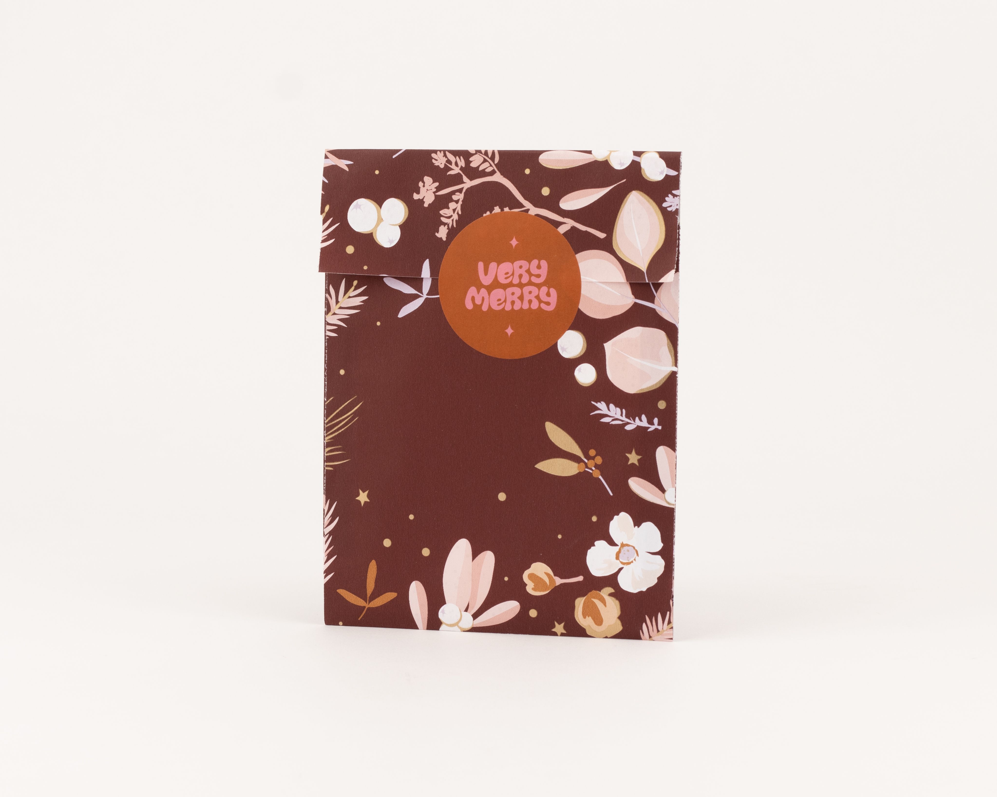 Flachbeutel in Weinrot mit floralem Wintergarten-Muster in Rosa und Lila, dazu goldene Akzente. Die Innenseite zeigt goldene Sterne und Punkte