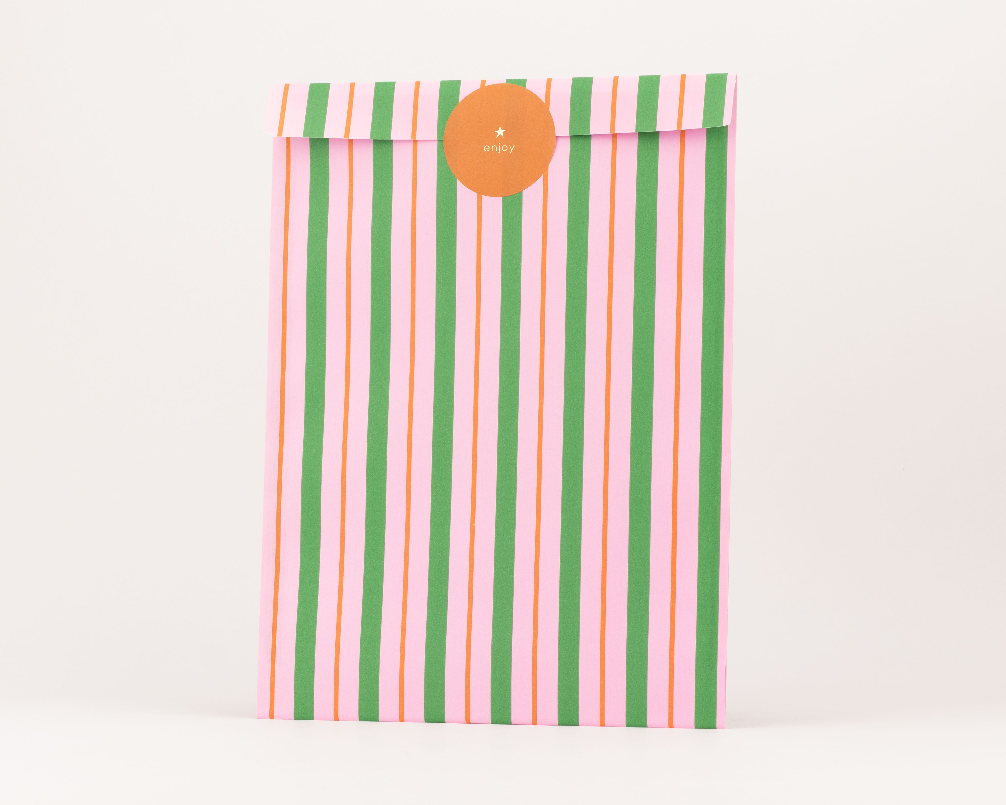 Flachbeutel mit vertikalen Streifen in Pink, Orange und Grün, die eine weiße Innenseite aufweisen