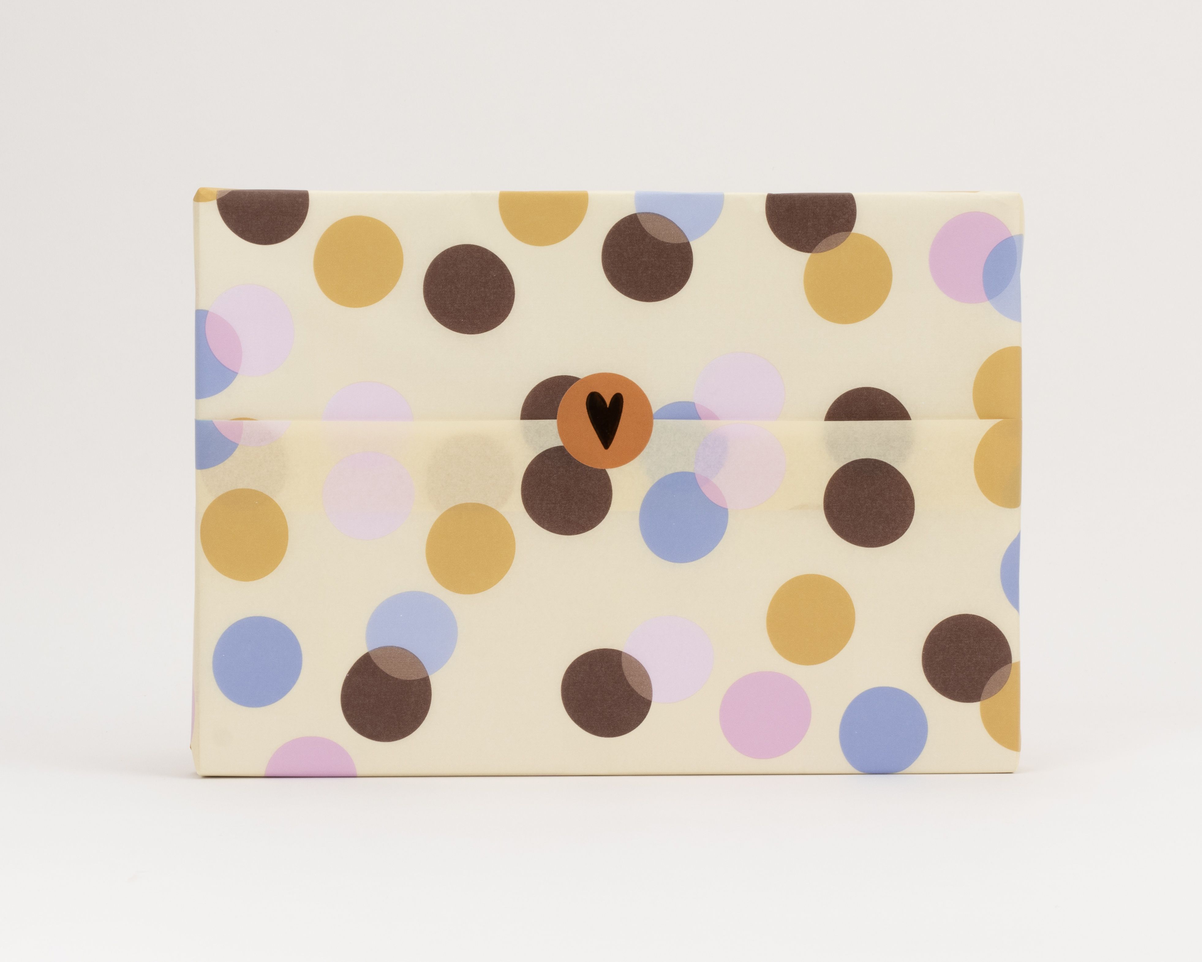 Seidenpapier mit Konfetti-Muster auf cremefarbenem Grund in Flieder, Hellblau, Warmem Orange und Hellrosa