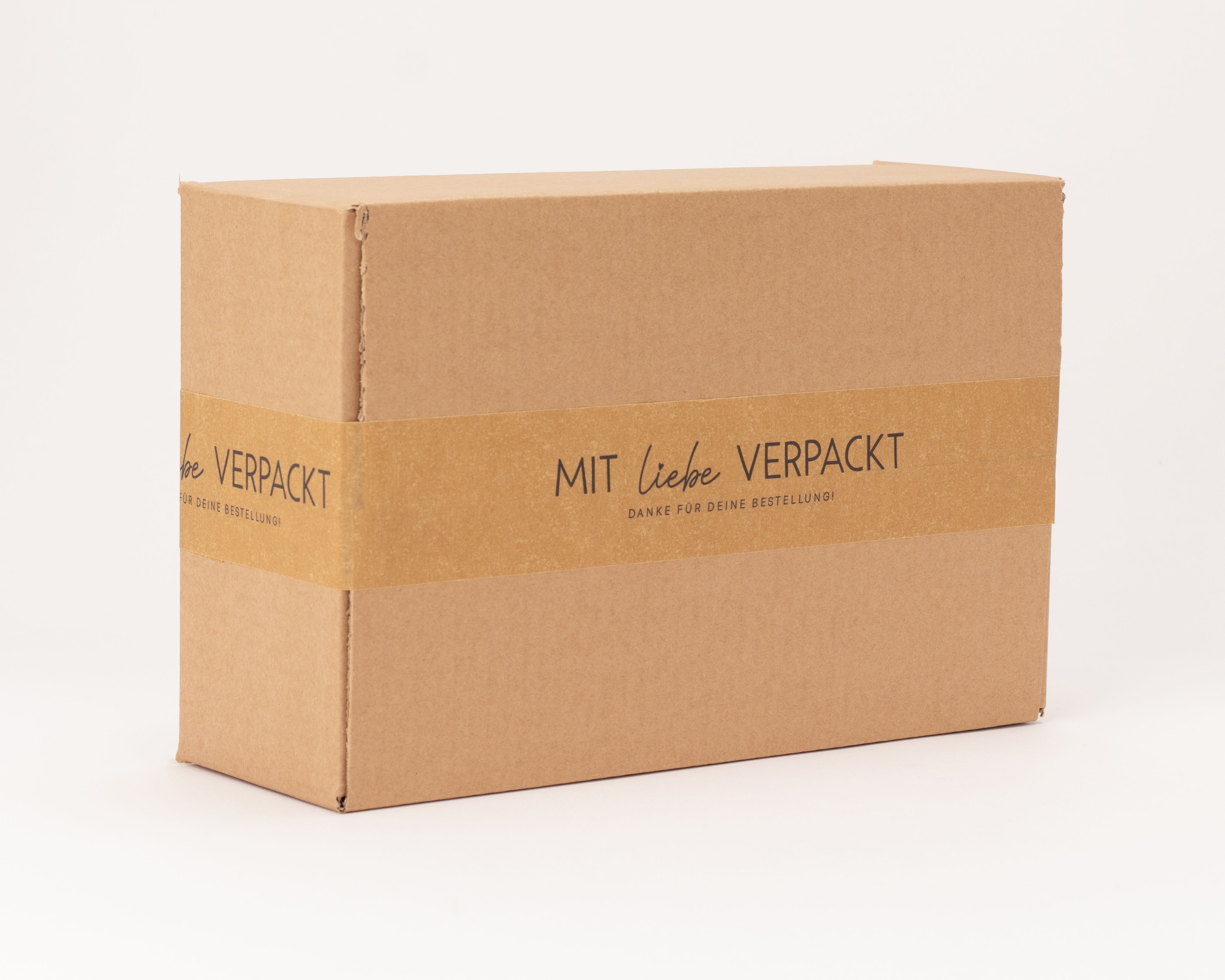 Papierklebeband, braun, mit Aufdruck 'Mit Liebe verpackt, danke für deine Bestellung!'. Zum Verschließen und Aufwerten von Verpackungen.