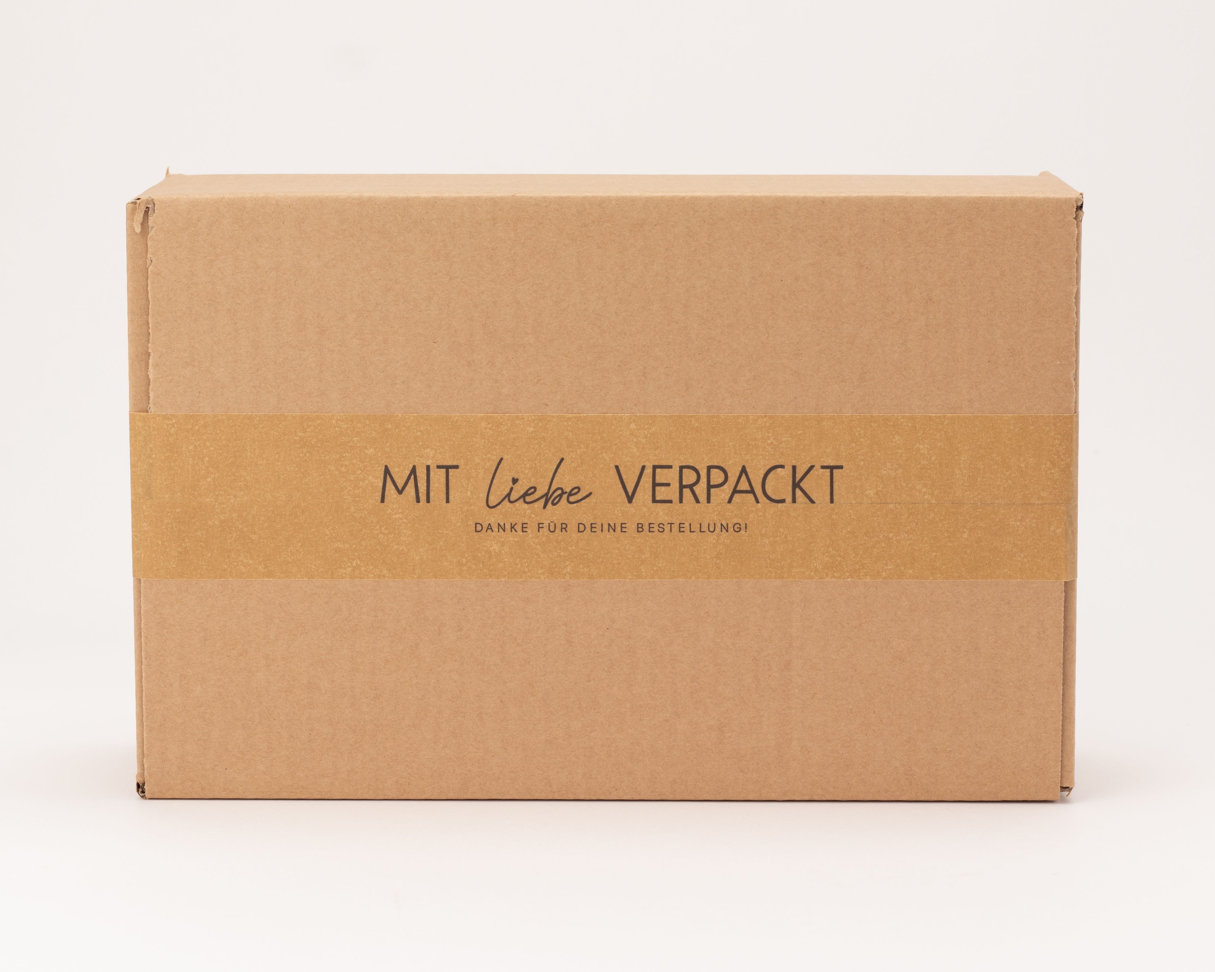 Papierklebeband, braun, mit Aufdruck 'Mit Liebe verpackt, danke für deine Bestellung!'. Zum Verschließen und Aufwerten von Verpackungen.